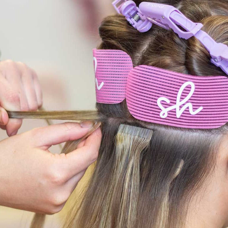 Tape hair extensions being fitted